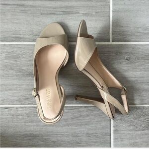 Tan open toed slick back heels
Nine West